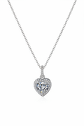 Close-up of The Celeste Heart Necklace featuring a sparkling heart-shaped zircon stone with a pavé halo, set in solid 925 sterling silver.
