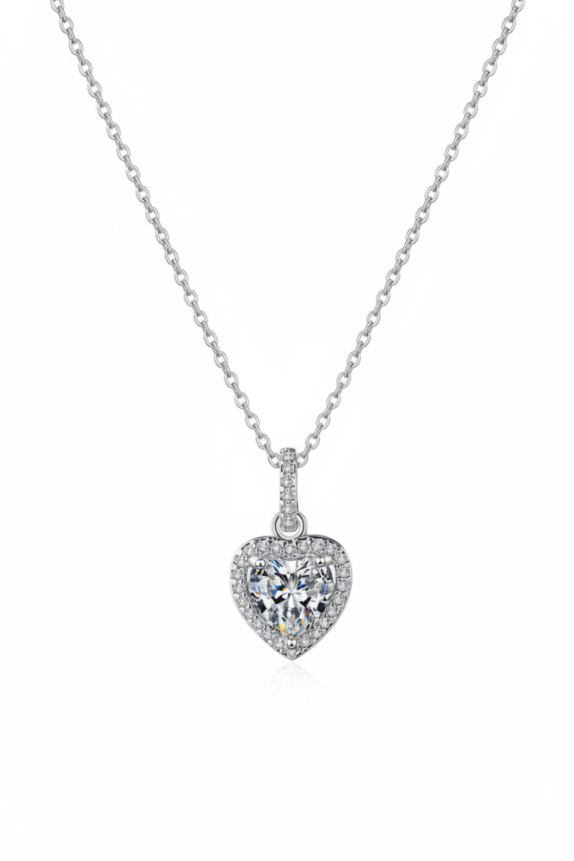 Close-up of The Celeste Heart Necklace featuring a sparkling heart-shaped zircon stone with a pavé halo, set in solid 925 sterling silver.
