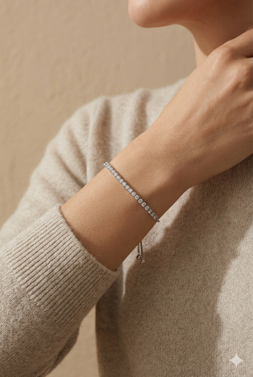 Minimalist 925 sterling silver Vera tennis bracelet on a woman's wrist.