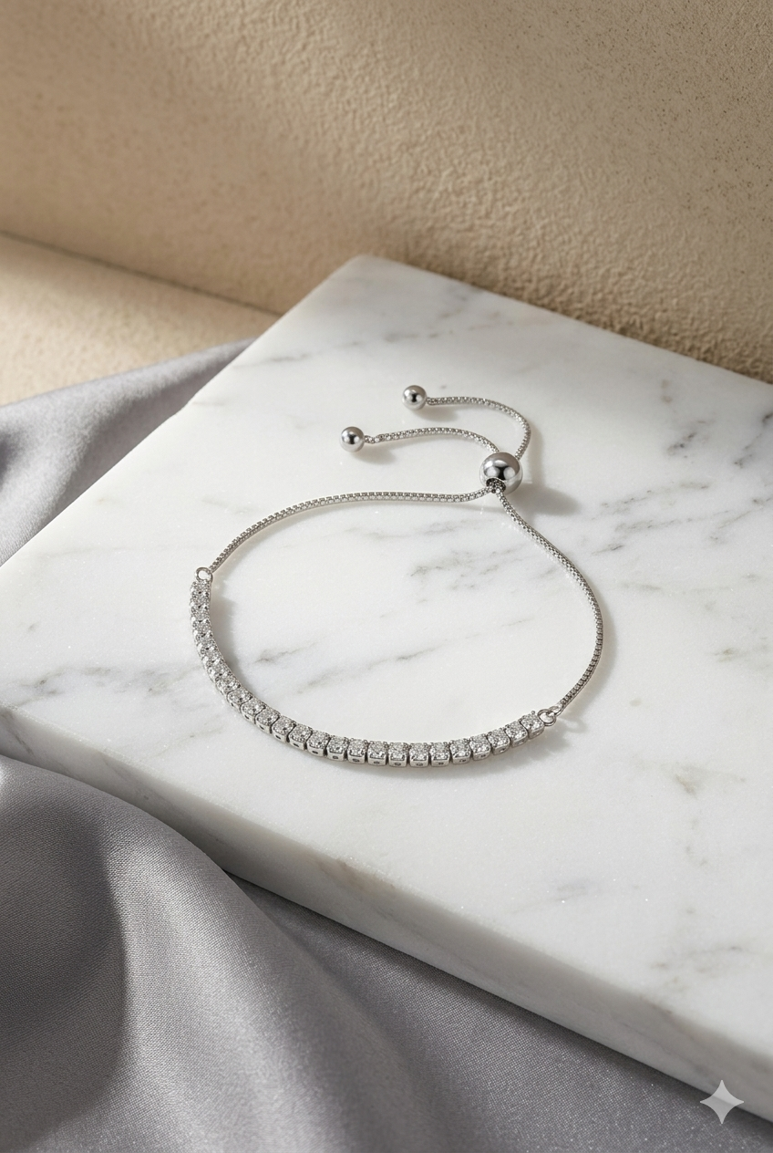 Minimalist 925 sterling silver Vera tennis bracelet on a woman's wrist.