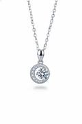 Close-up of The Selene Necklace featuring a 1.0 carat moissanite center stone cradled by a pavé crescent moon, set in solid 925 sterling silver.