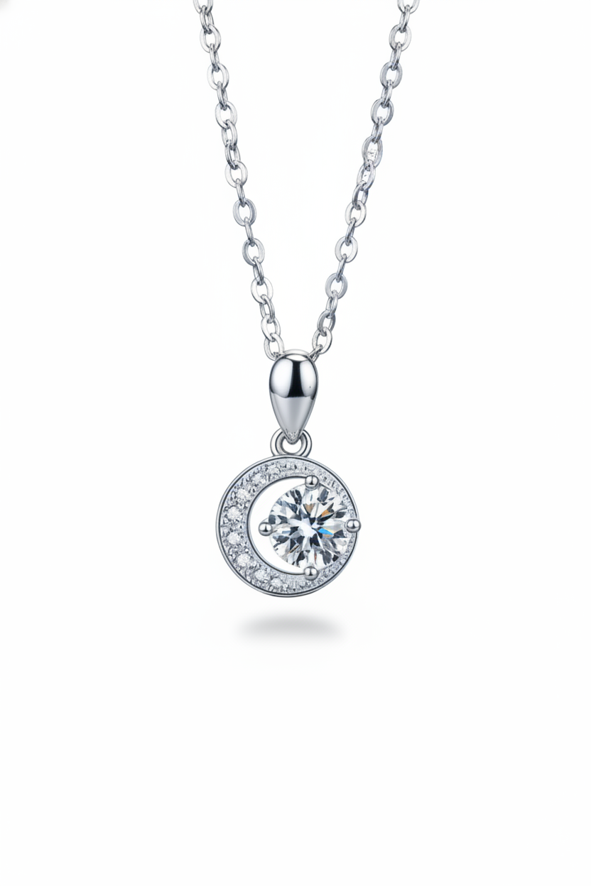 Close-up of The Selene Necklace featuring a 1.0 carat moissanite center stone cradled by a pavé crescent moon, set in solid 925 sterling silver.