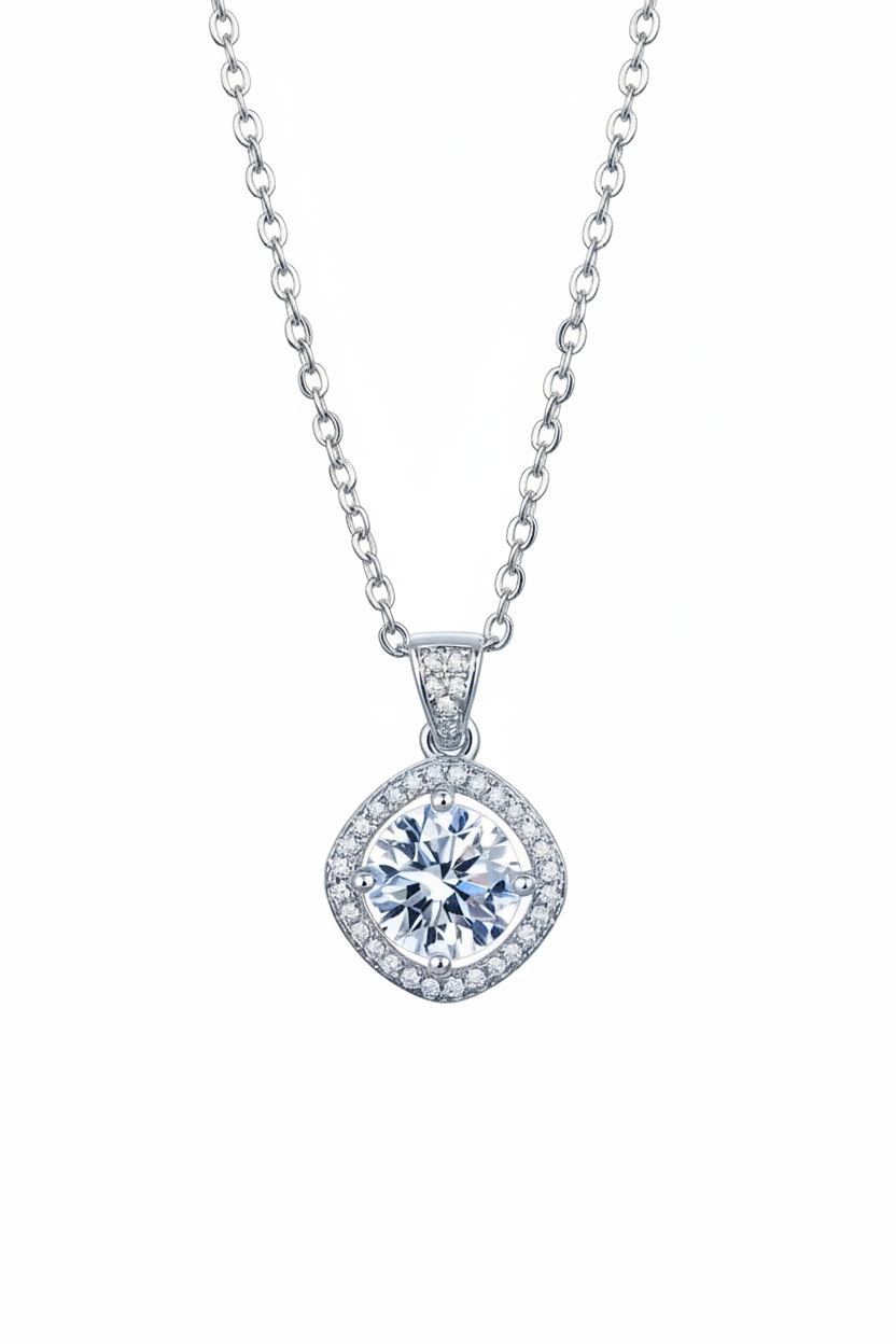 Close-up of The Aurelia pendant featuring a 1.0 carat moissanite surrounded by a cushion-shaped pavé halo in solid 925 sterling silver.