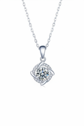 Close-up of The Nova pendant, featuring a 1.0 carat round moissanite stone centered inside a sharp square pavé halo in solid 925 silver.