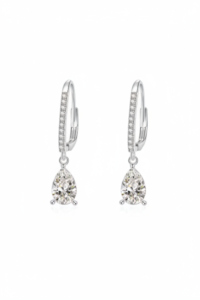 Close-up of The Lyra drop earrings featuring a brilliant clear teardrop-shaped stone in a high-polish solid 925 sterling silver setting.