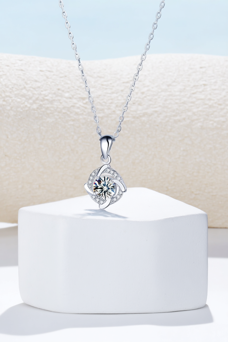 Close-up of The Nova pendant, featuring a 1.0 carat round moissanite stone centered inside a sharp square pavé halo in solid 925 silver.