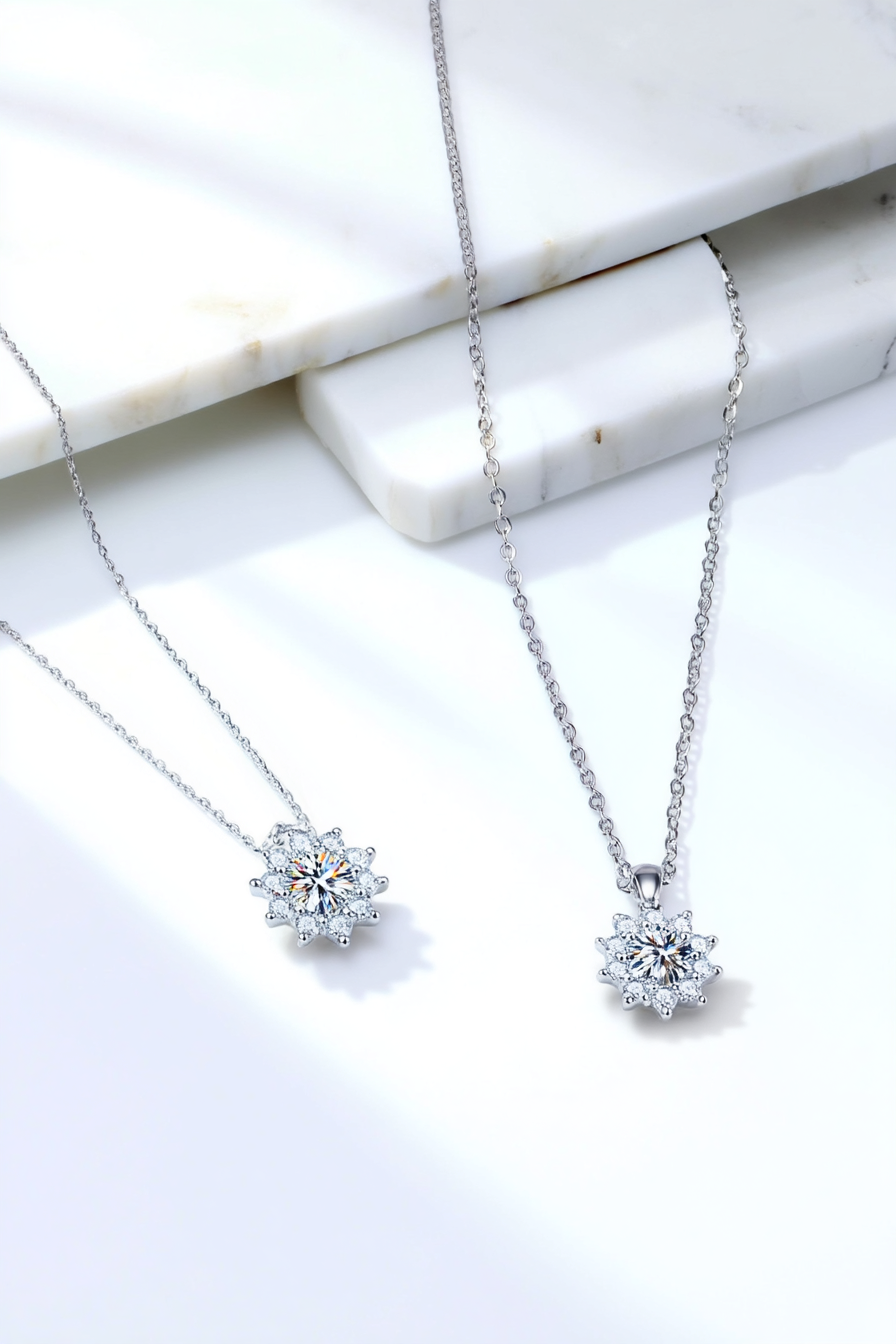 Close-up of a 1.0 carat moissanite pendant with a floral pavé halo, set in solid 925 sterling silver.