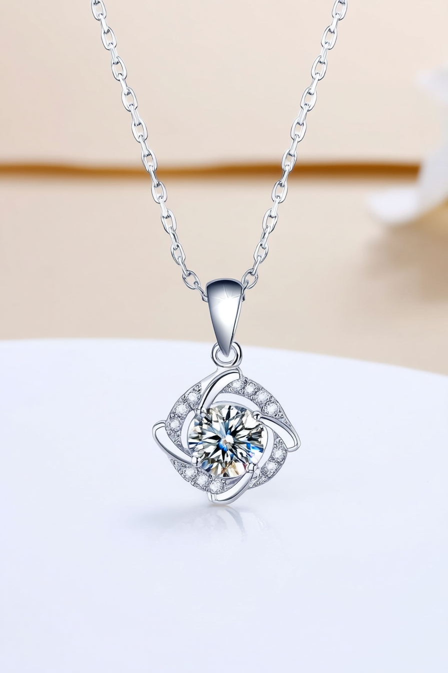 Close-up of The Nova pendant, featuring a 1.0 carat round moissanite stone centered inside a sharp square pavé halo in solid 925 silver.