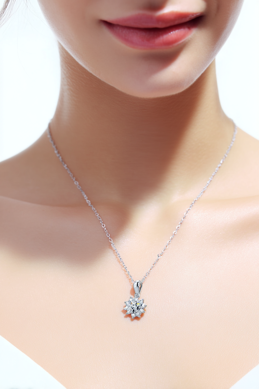 Close-up of a 1.0 carat moissanite pendant with a floral pavé halo, set in solid 925 sterling silver.