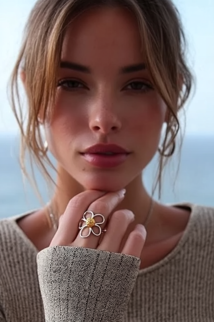Delicate 925 sterling silver ring with a hollow-out clover floral design, minimalist handcrafted silver jewelry by Nura Label.