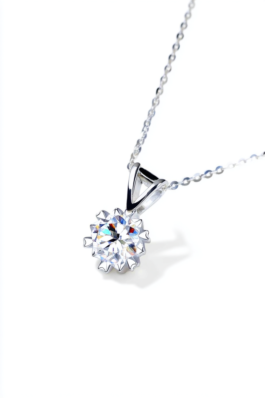 Close-up of The Zephyr necklace featuring a brilliant 1.0 carat moissanite center stone set in a solid S925 silver windmill halo.