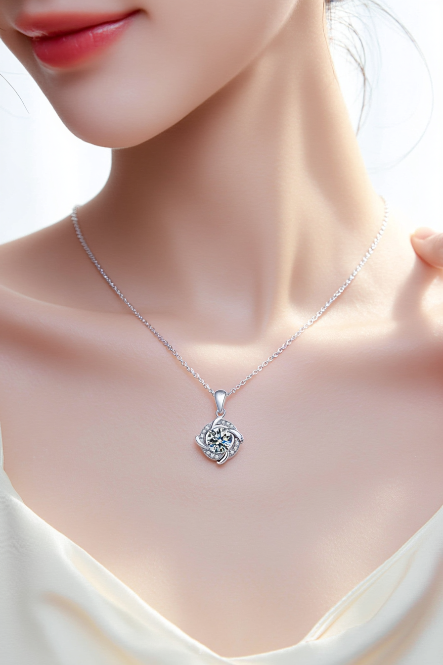 Close-up of The Nova pendant, featuring a 1.0 carat round moissanite stone centered inside a sharp square pavé halo in solid 925 silver.