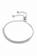 Minimalist 925 sterling silver Vera tennis bracelet on a woman's wrist.