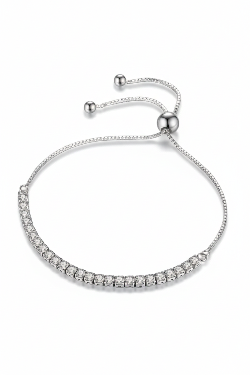 Minimalist 925 sterling silver Vera tennis bracelet on a woman's wrist.