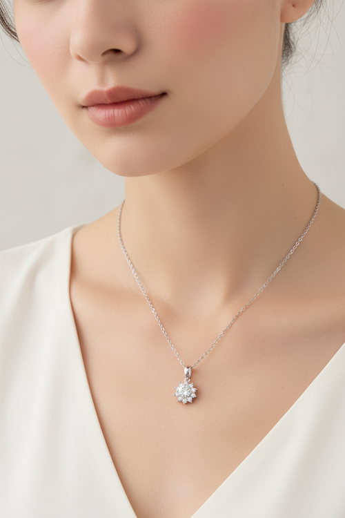 Close-up of a 1.0 carat moissanite pendant with a floral pavé halo, set in solid 925 sterling silver.