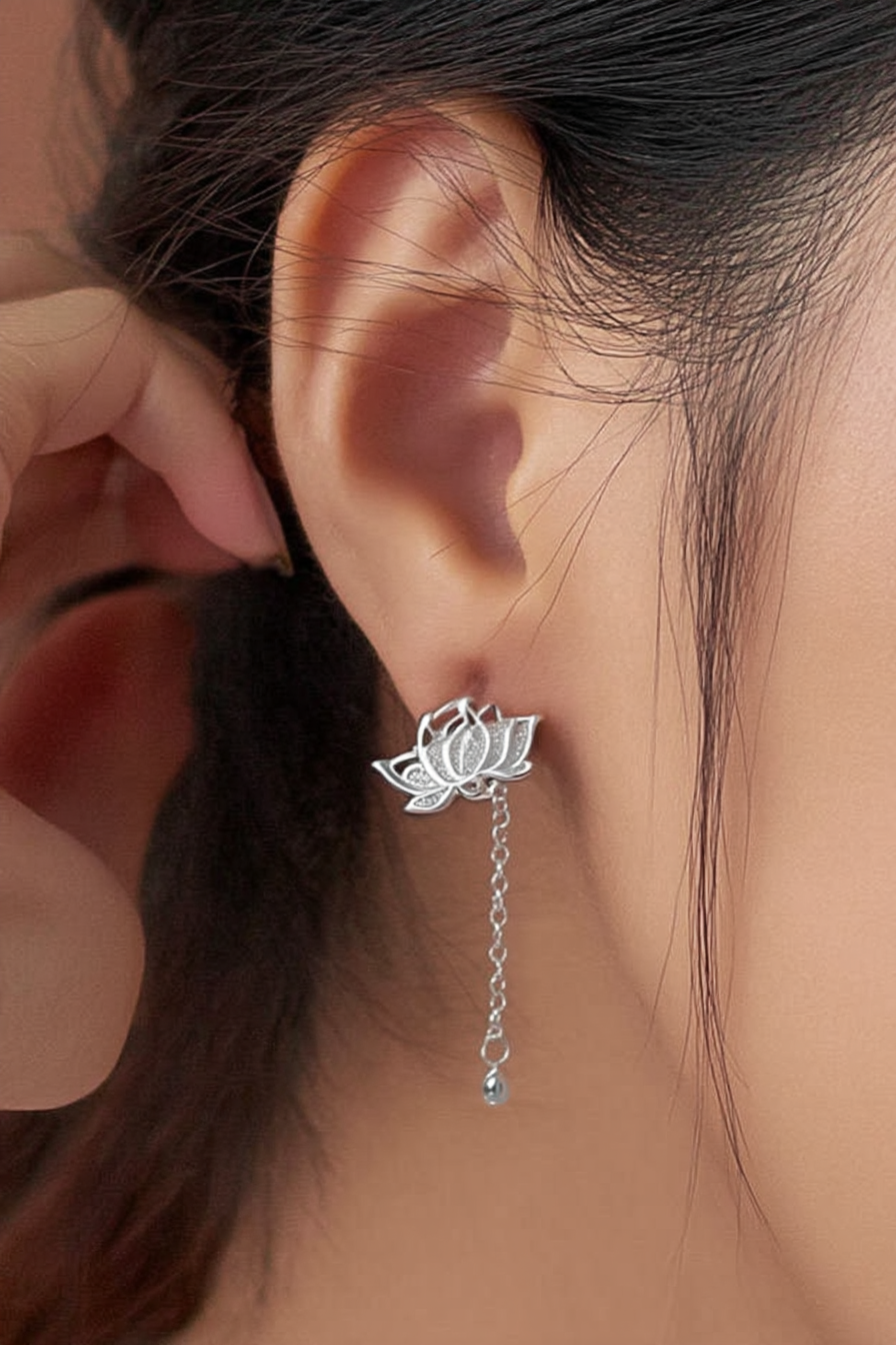 Close-up of The Papillon stud earrings, showcasing the delicate hollow butterfly silhouette in high-polish solid 925 sterling silver.