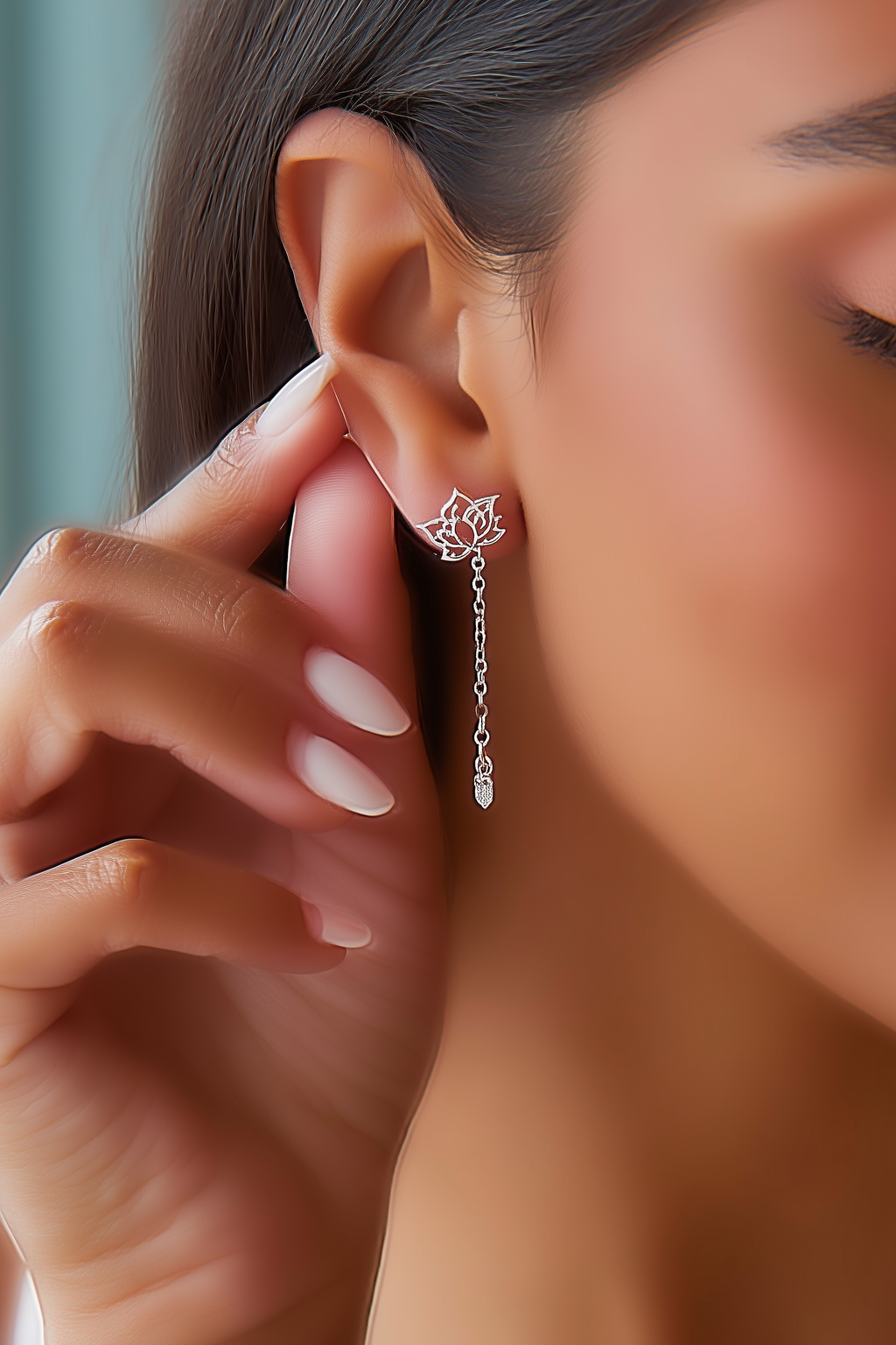 Close-up of The Papillon stud earrings, showcasing the delicate hollow butterfly silhouette in high-polish solid 925 sterling silver.
