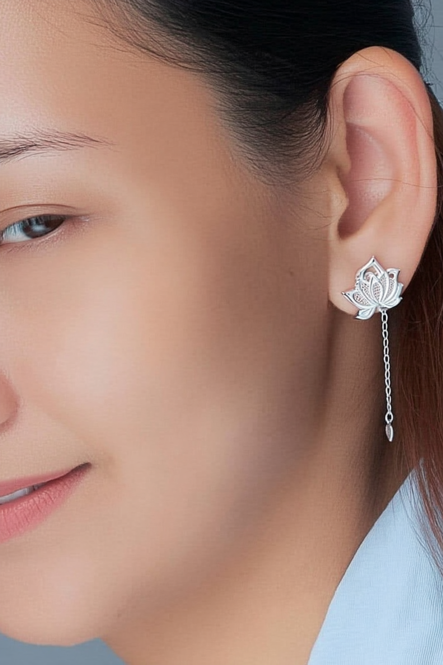 Close-up of The Papillon stud earrings, showcasing the delicate hollow butterfly silhouette in high-polish solid 925 sterling silver.