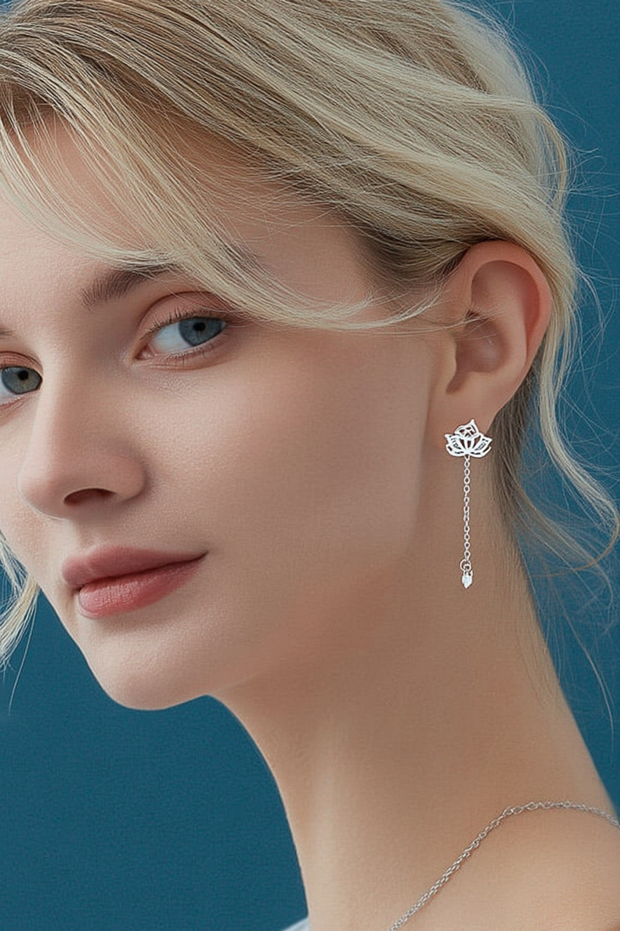 Close-up of The Papillon stud earrings, showcasing the delicate hollow butterfly silhouette in high-polish solid 925 sterling silver.